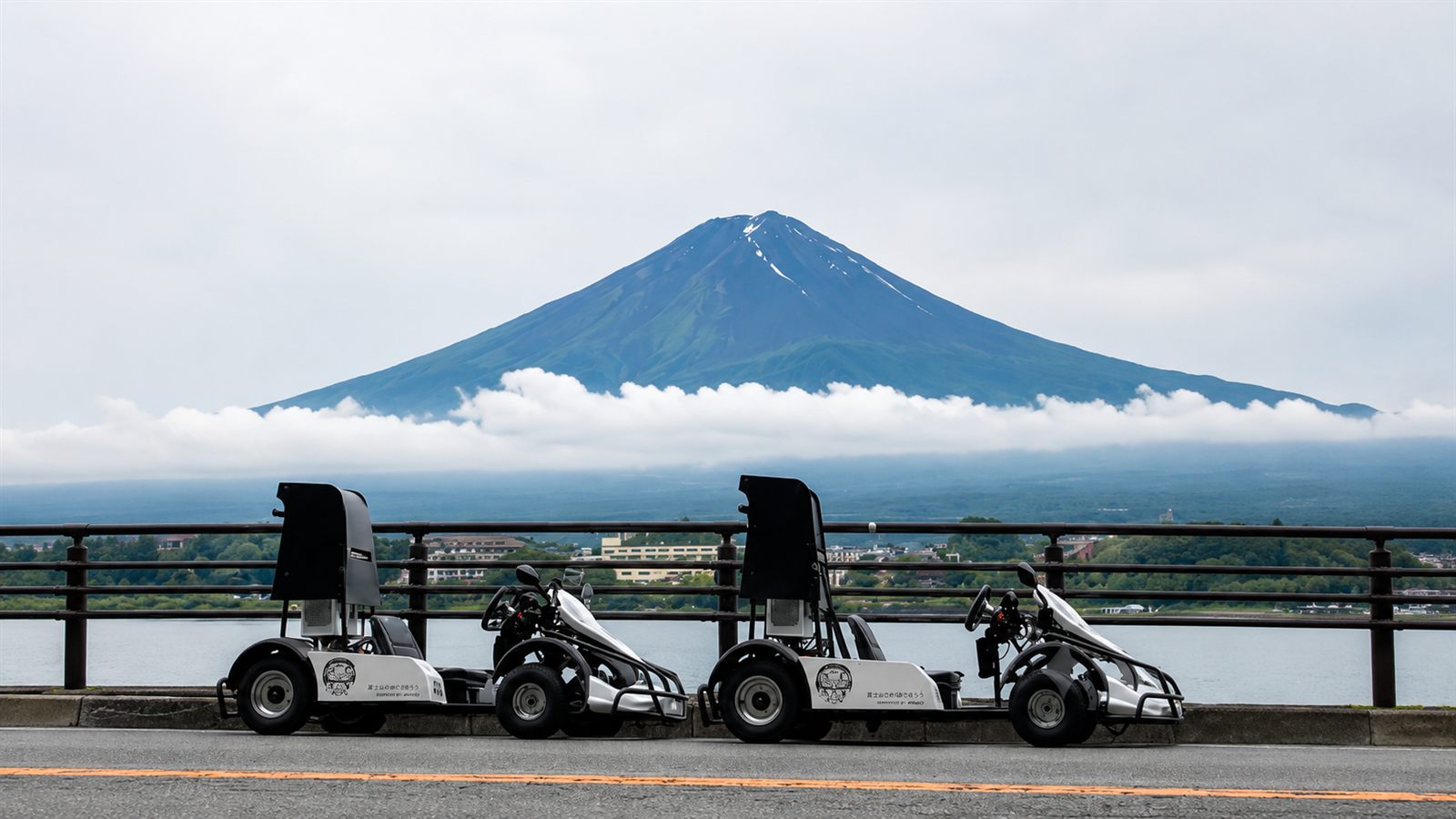 Electric go-karts in Fujiyoshida Honcho with snow-capped Mt. Fuji